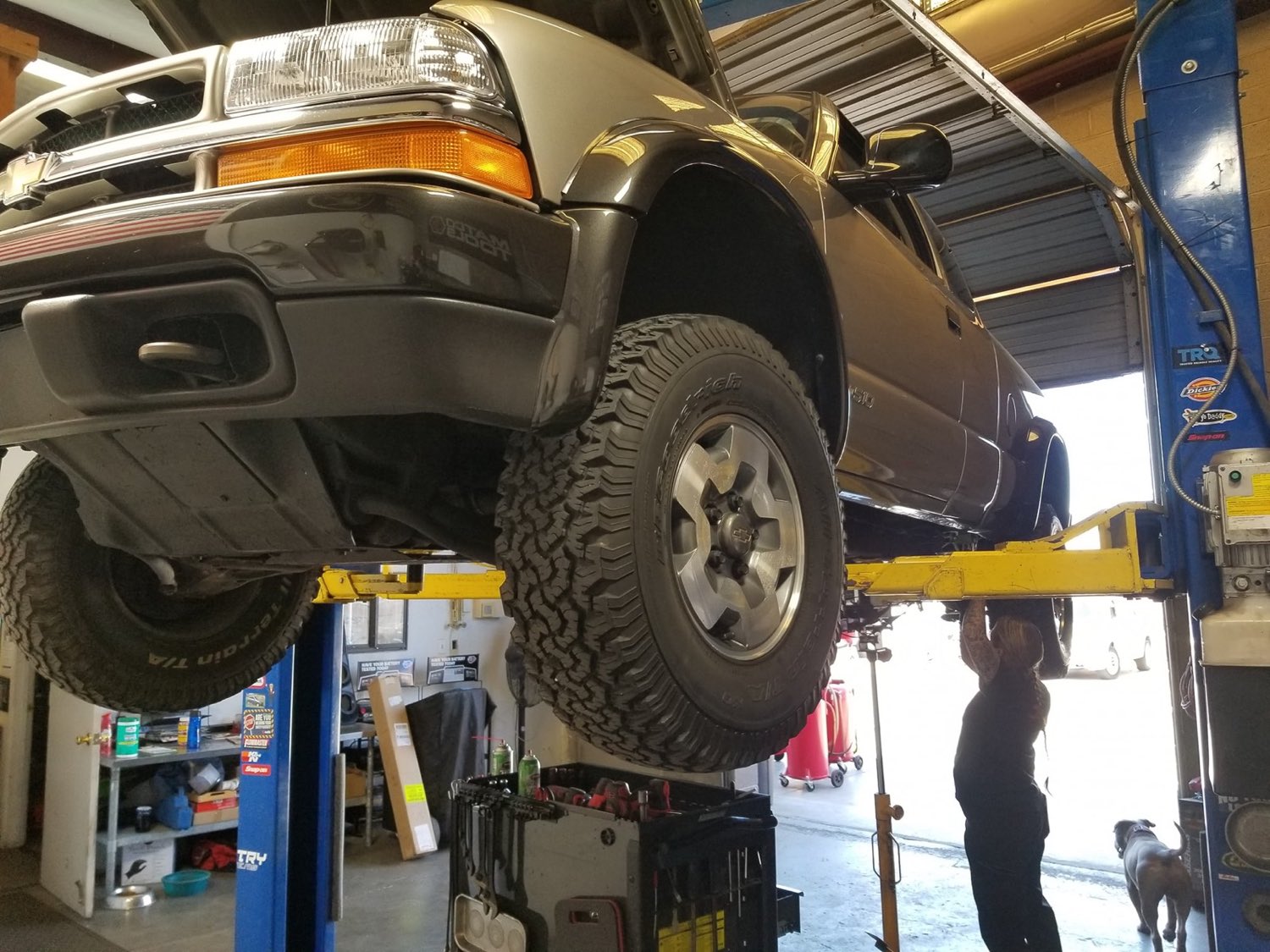 Truck raised on the lift for brake and suspension work at Autoworks