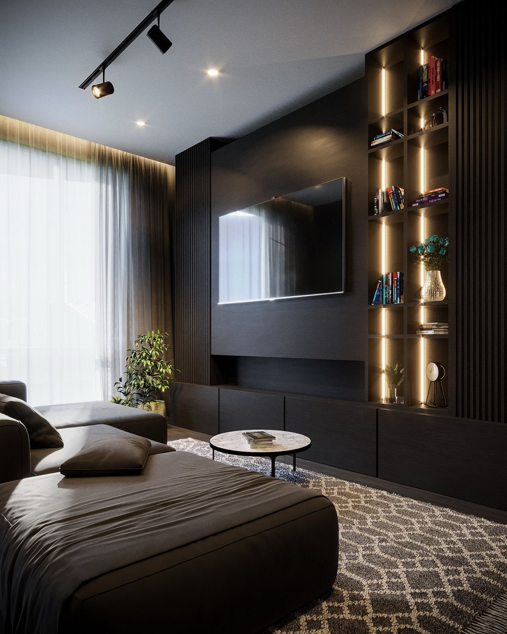 A modern, dark-toned living room with warm gold-lit shelving, a wall-mounted television and a round marble coffee table