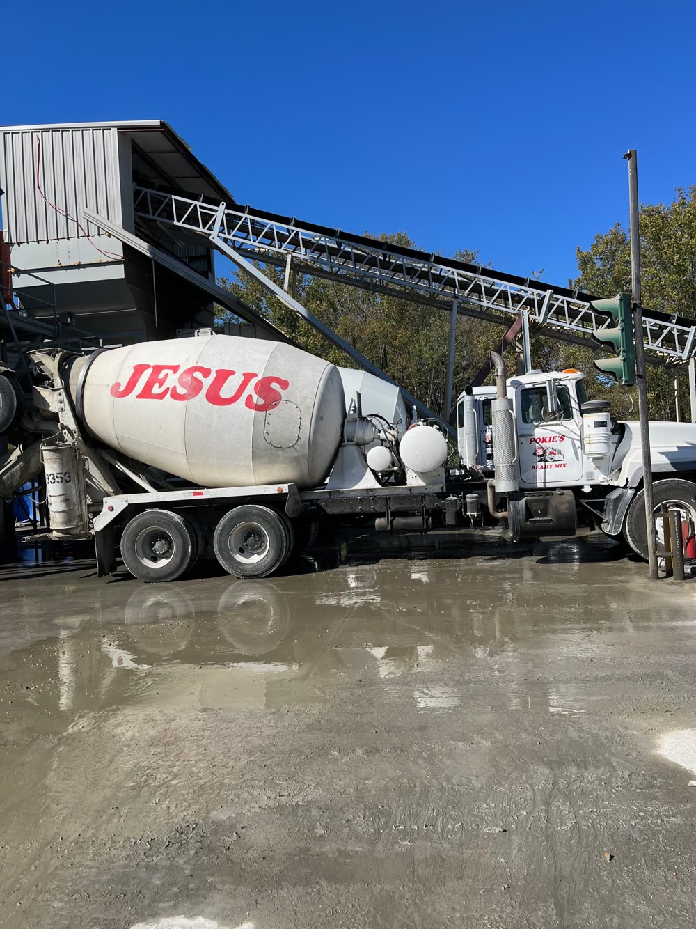 Pokie's mixer loading out under the batch plant conveyor