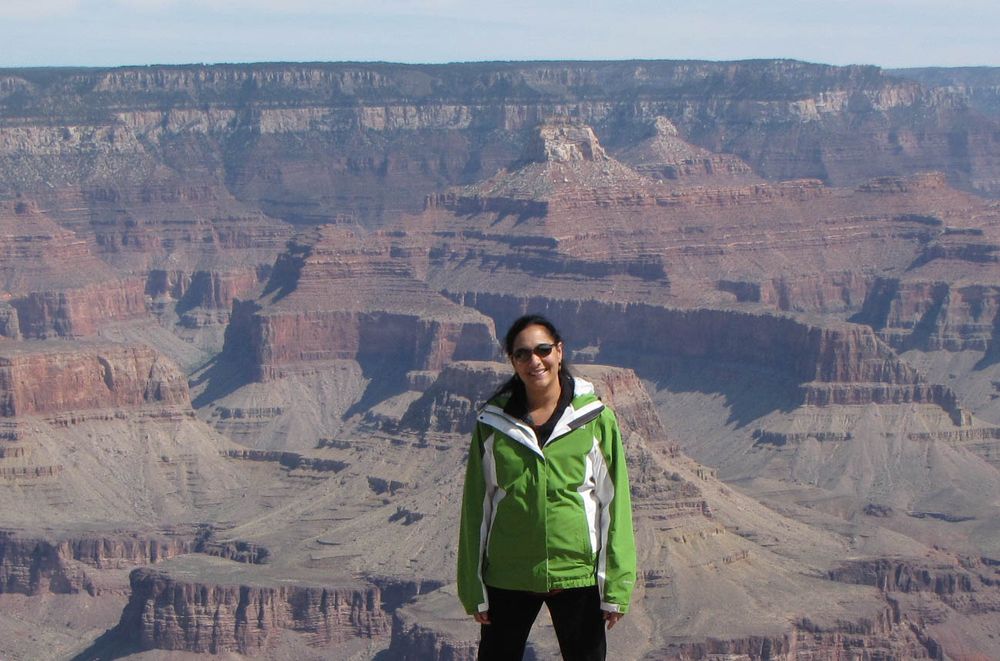 Anju standing at the rim of the Grand Canyon