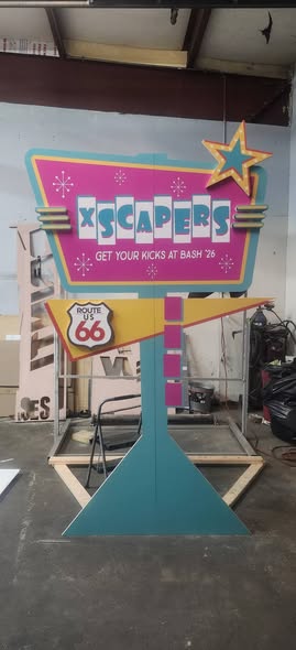 Retro Route 66 style dimensional Xscapers sign standing in the shop