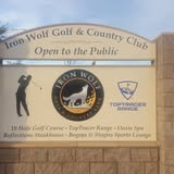Iron Wolf Golf & Country Club roadside sign with golfer silhouette